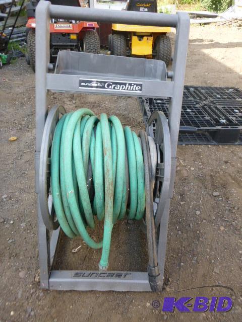 lot 146 image: Hose Reel with Garden Hose Reel appears to be...