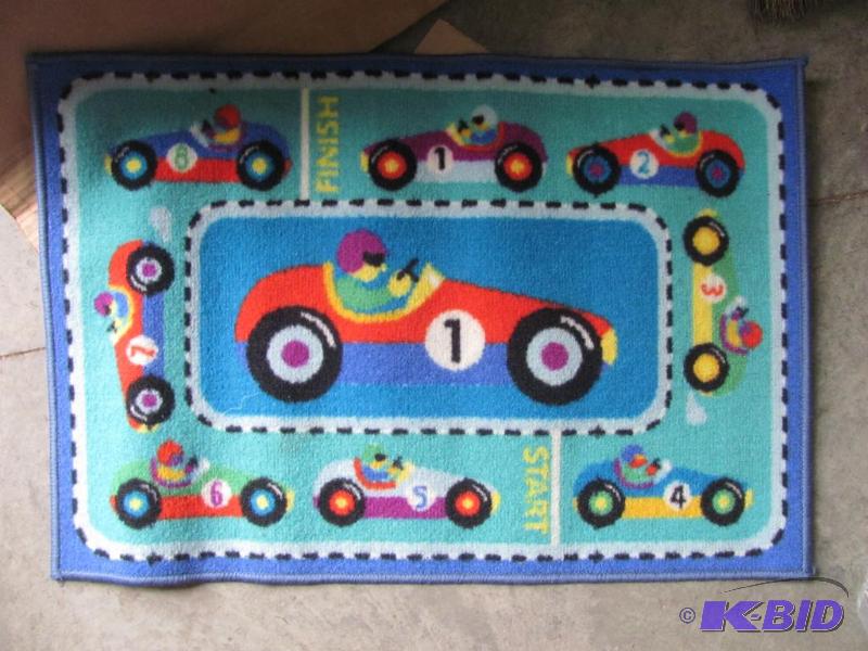 lot 117 image: Like-New OLIVE KIDS 19x29-inch Racecar Area R...