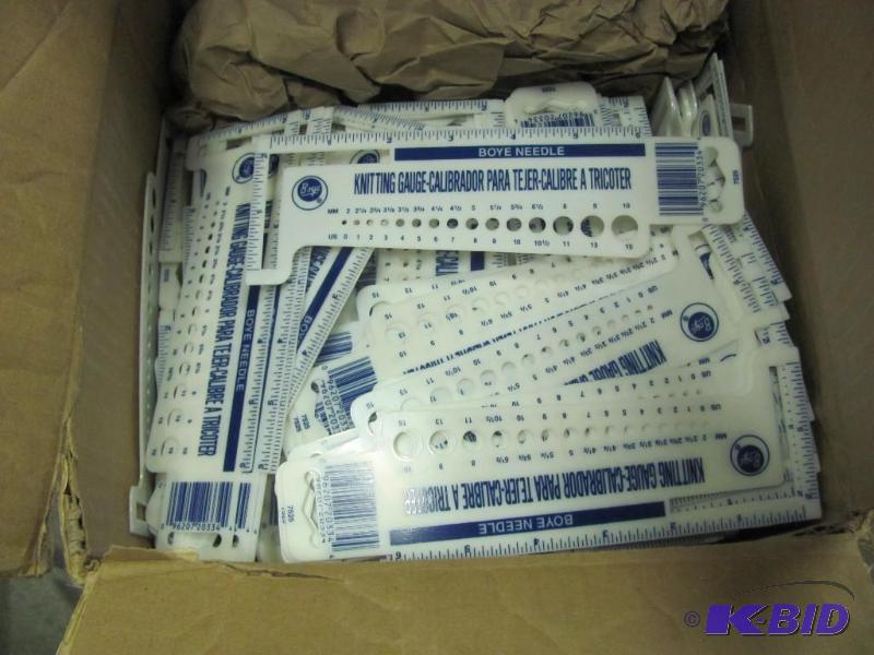 lot 140 image: Box of NEW Plastic Knit Gauges. Looks to be a...