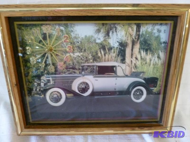 lot 120 image: Wood framed wall clock that measures 11"...