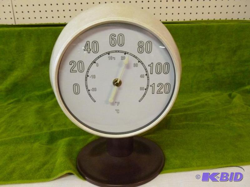 lot 22 image: Large glow in the dark sundial thermometer, m...