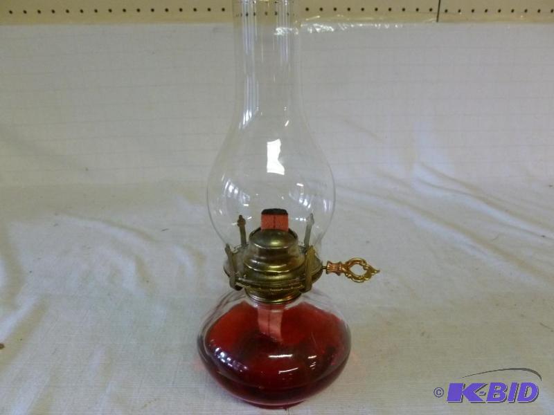 lot 221 image: Large oil lamp that measures 12" H, good...