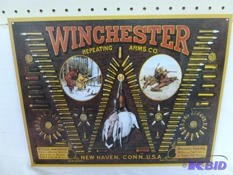 lot 24 image: Winchester Repeating Arms metal sign that mea...