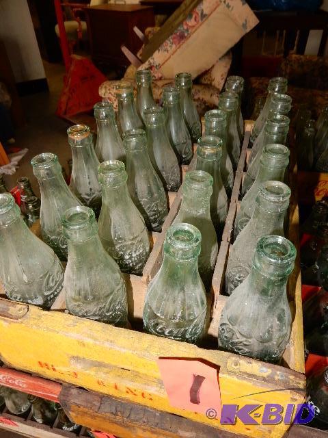 24 Vintage GLASS Coke bottles.. Names of town...