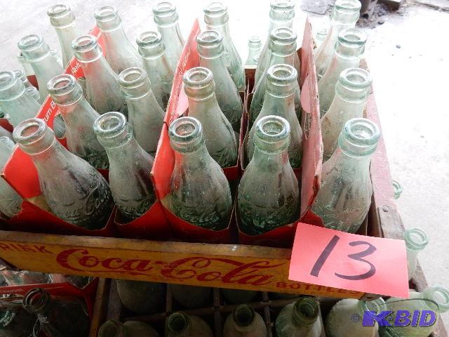 24 Vintage GLASS Coke bottles.. Names of town...