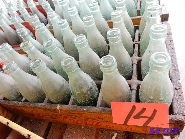 24 Vintage GLASS Coke bottles.. Names of town...