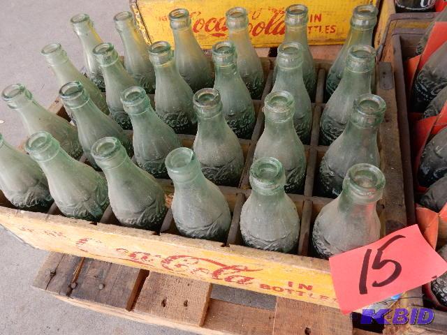 24 Vintage GLASS Coke bottles.. Names of town...
