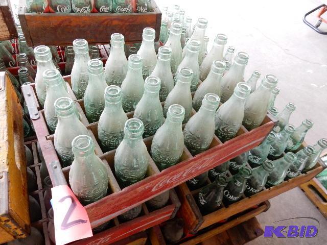 24 Vintage GLASS Coke bottles.. Names of town...