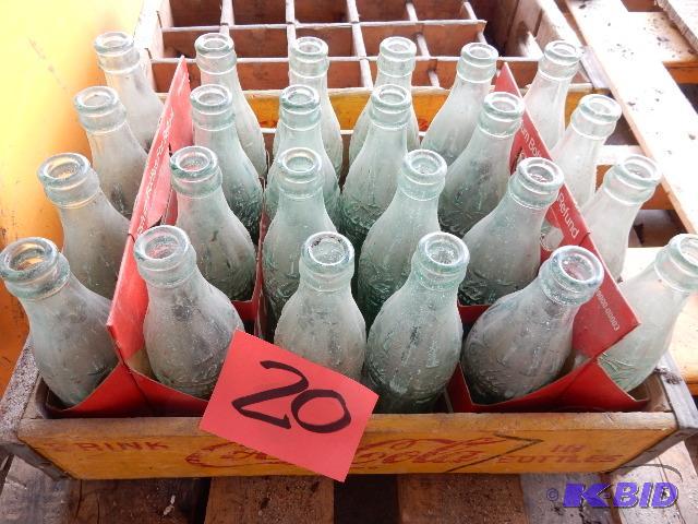 24 Vintage GLASS Coke bottles.. Names of town...