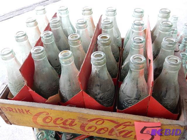24 Vintage GLASS Coke bottles.. Names of town...