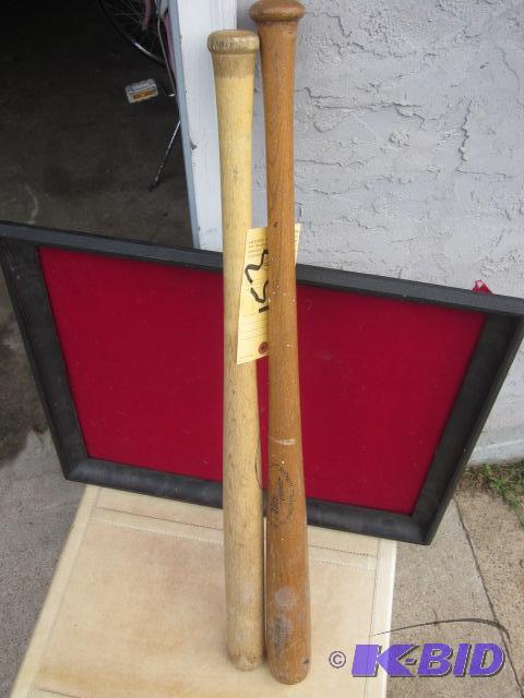 Pair of vintage wooden bats, including genuin...