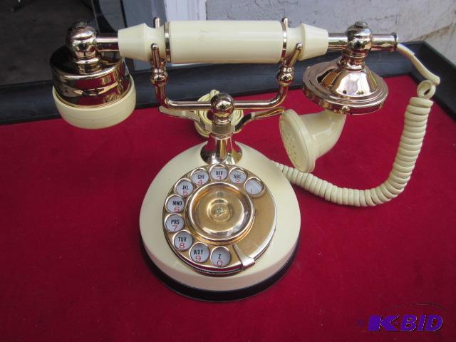 Vintage yellow cradle style phone, rotary dia...