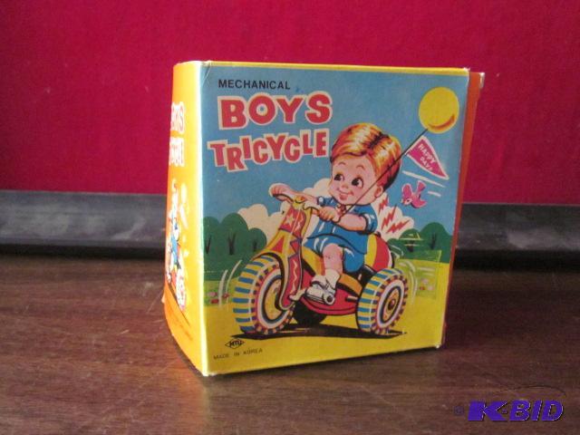 Vintage mechanical boys tricycle tin toy with...