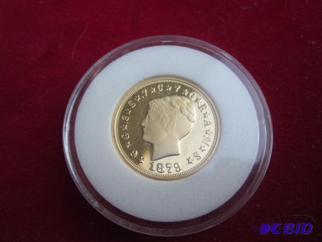 1879 gold One Stella coin copy, in plastic ca...