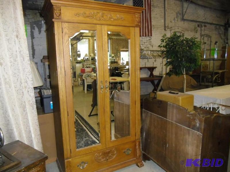 lot 20017 image: Oak Armoire Reproduction of 1880s Style - Carved Lion Head Double Mirrored Doors