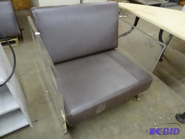 lot 23 image: Plexiglass Chair with Removable Cushions. The...