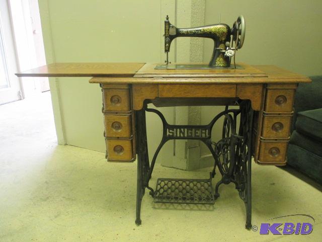 lot 11 image: Antique Singer Sewing Machine Victorian Design Wood Cabinet