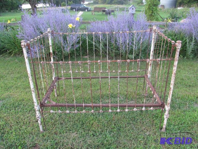 Vintage iron crib   Flower beds dont get an...