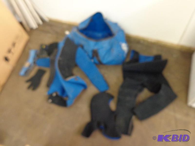 lot 18 image: Diving Bag, Suit, Book and Other Diving Suppl...
