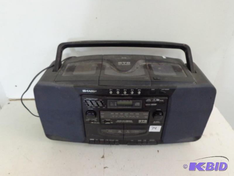 lot 74 image: Sharp 5 Disc CD, AMFM Radio, and Dual Casset...