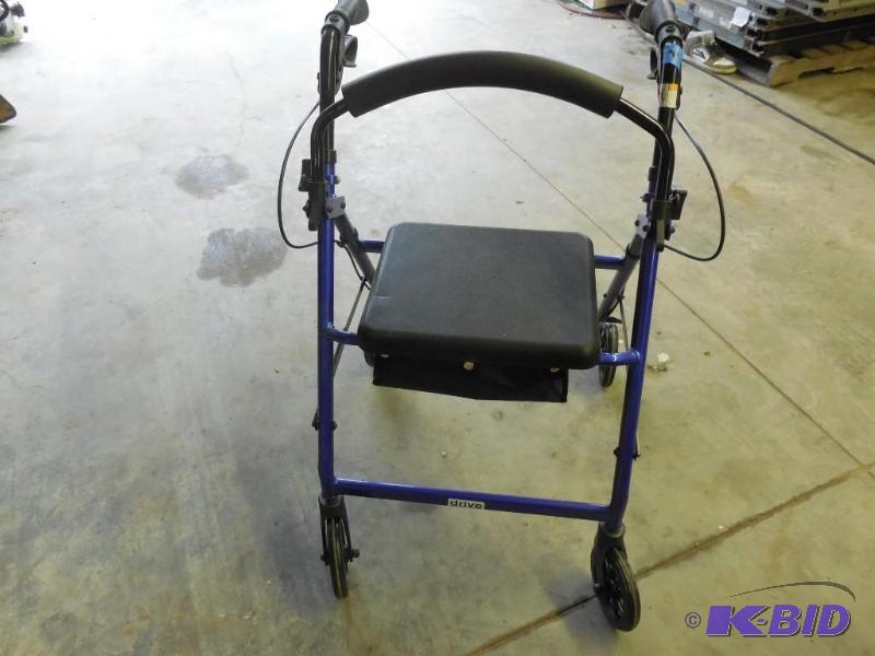 lot 41 image: Rolling walker with attached chair....