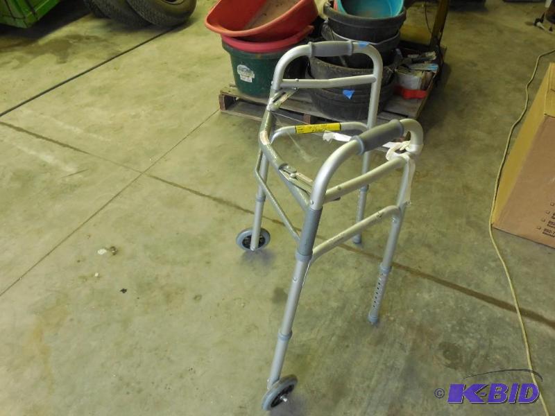 lot 42 image: Walker with 2 wheels on front...