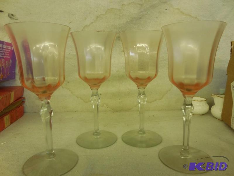 4 Tall wine glasses...