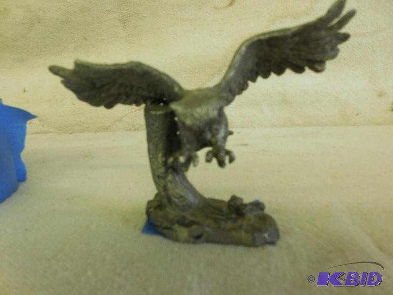 Heavy metal owl, might be made of pewter...
