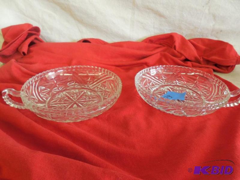 2 Glass bowls with one handle...