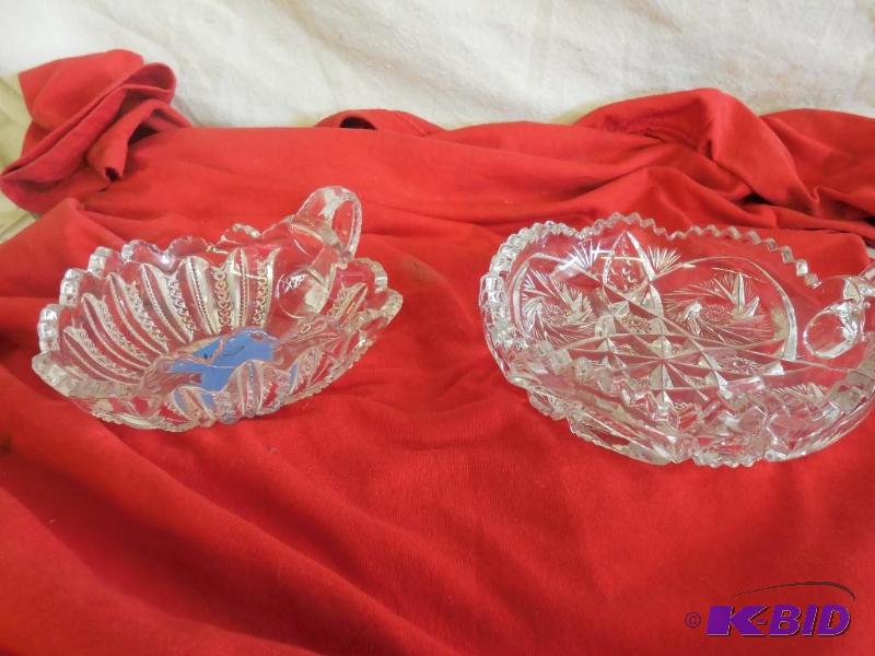 2 Glass bowls with one handle...
