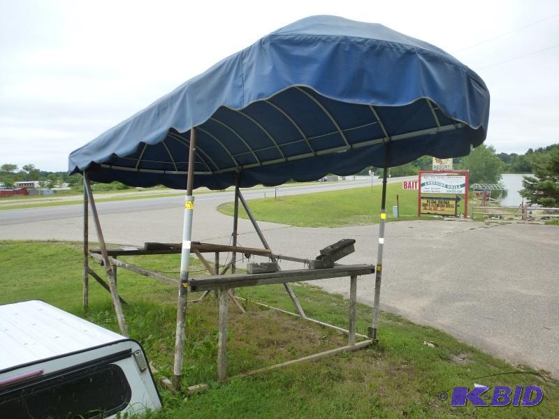 lot 9 image: Steel boat lift with canopy Has aluminum top...