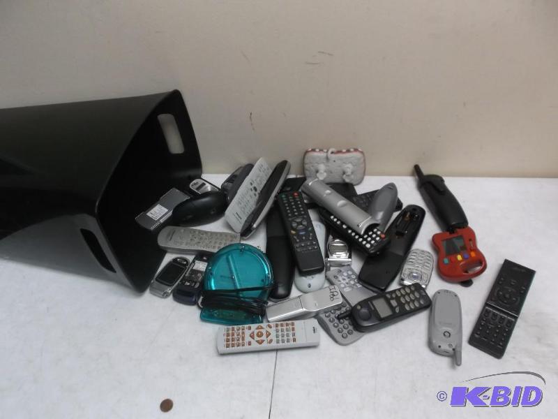 Small Trash Can Filled With Some Remotes And ...