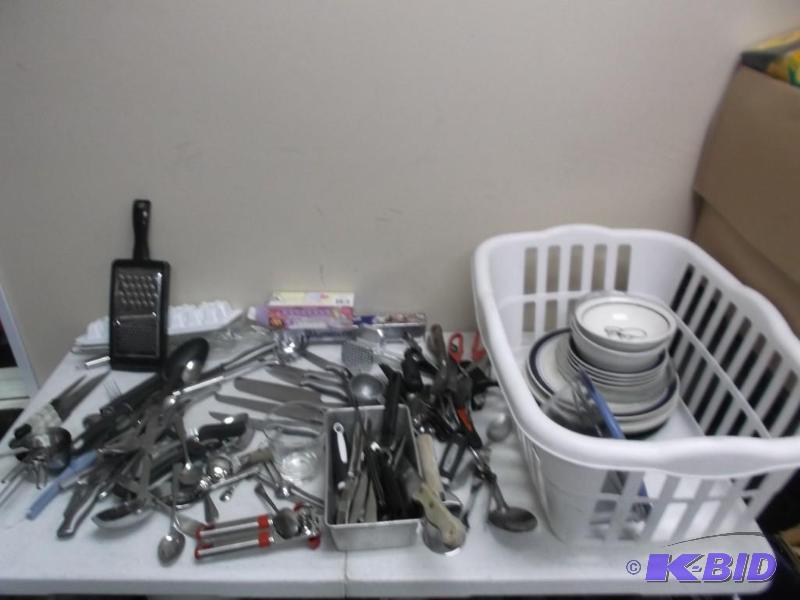White Basket Filled With Kitchen Items And Ut...