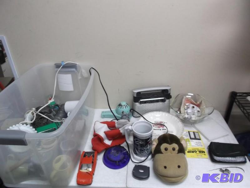 Clear Bin Filled With Items, Radio, Pie Dish...