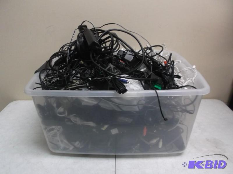 Clear Bin Filled With Wires And Power Cords...
