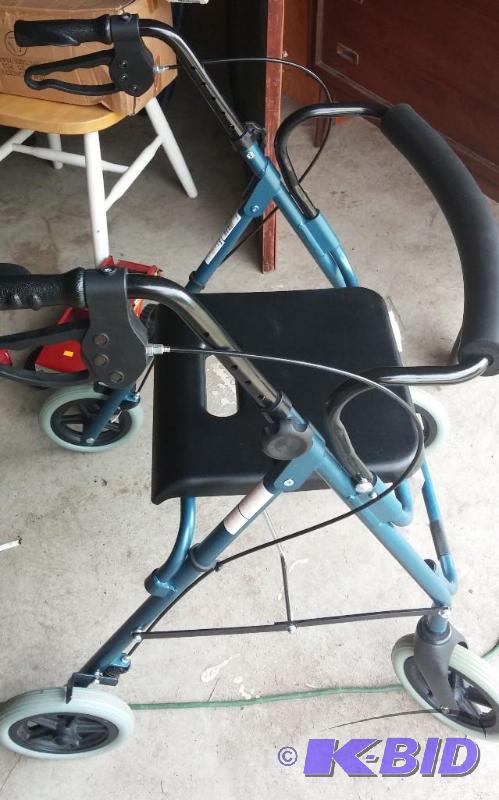 ALMOST NEW Walker with hand brakes and seat-g...