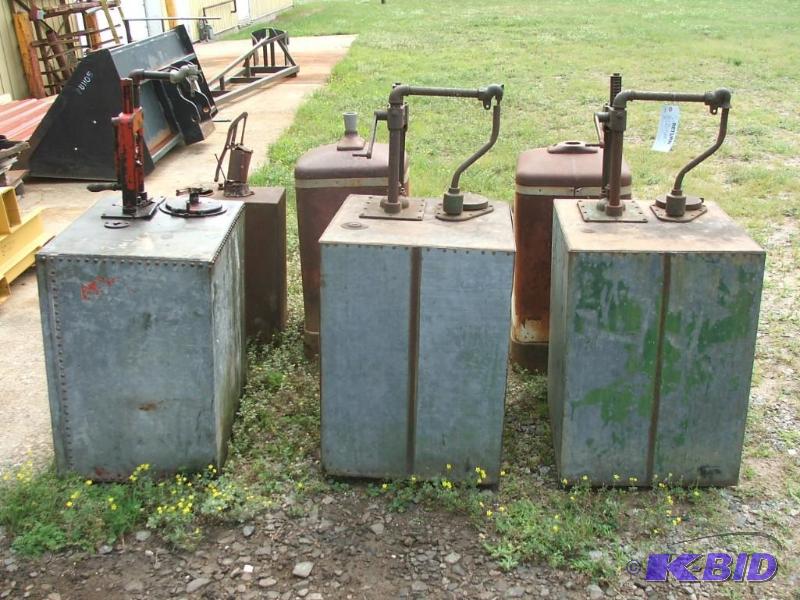 Vintage oil barrels with hand pumos...