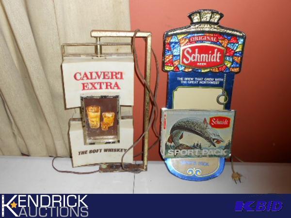 lot 126 image: Vintage Calvert Whiskey Light Up Spinning Clock Sign and a Vintage Schmidt Beer Sign