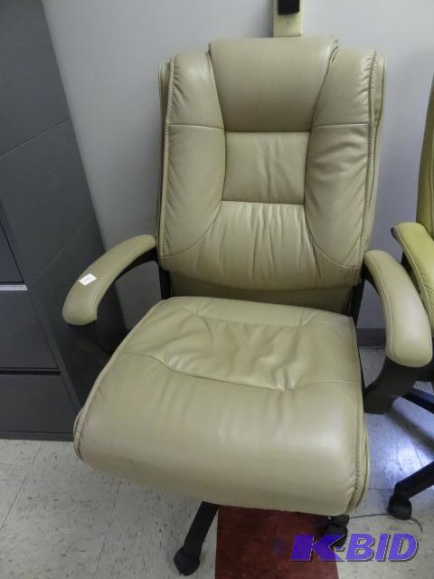 lot 1 image: Leather office chair on wheels. Adjustable he...