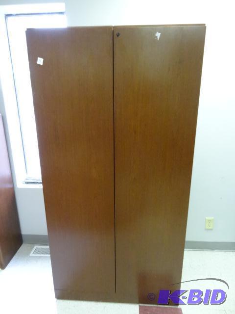lot 11 image: 2 door laminate cabinet. 36 x 24 x 71...