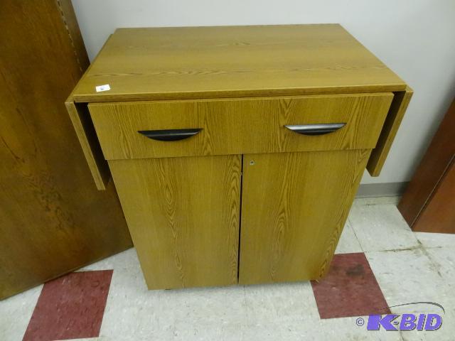 lot 120 image: cabinet on wheels with side extensions. 2 dra...