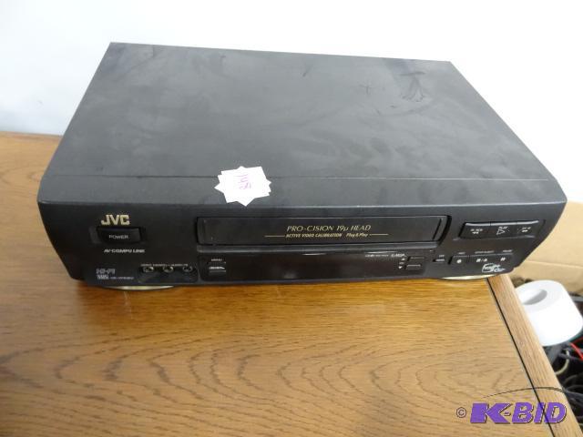 lot 148 image: JVC VHS player. Computer monitor stand....