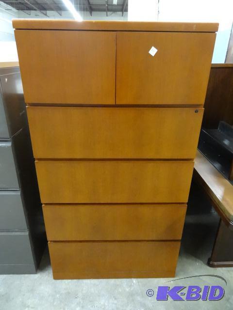 lot 211 image: laminate lateral cabinet. 4 drawers and 2 doo...