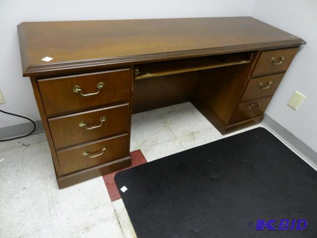 lot 51 image: Wood desk with 6 drawers and pull out keyboar...