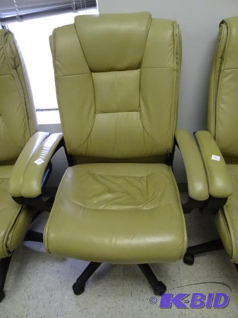 lot 7 image: Leather office chair on wheels. Adjustable he...