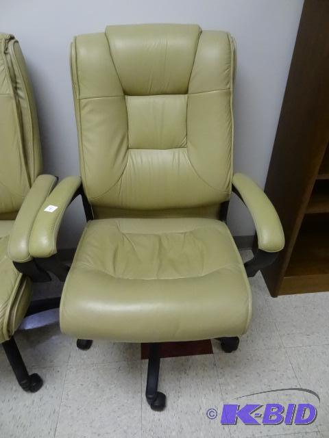 lot 8 image: Leather office chair on wheels. Adjustable he...