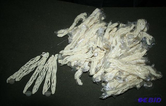 lot 3241 image: Necklace made with polished bone....