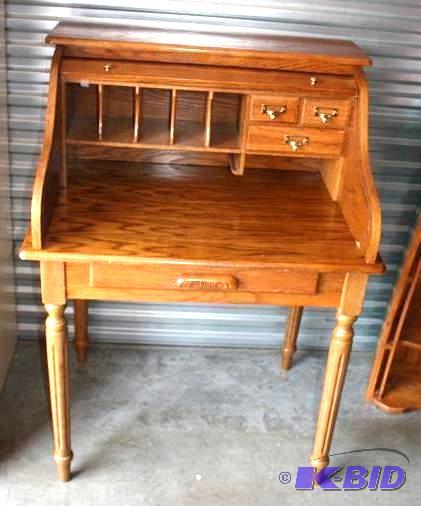 lot 4 image: Wood roll top desk. with cubbyholes and drawe...