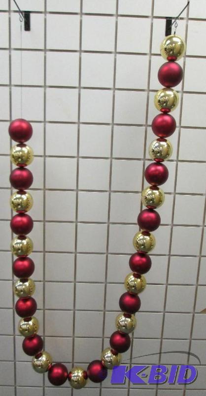 String of holiday dcor balls, each ball is ap...