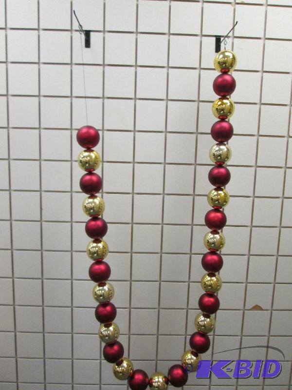 String of holiday dcor balls, each ball is ap...